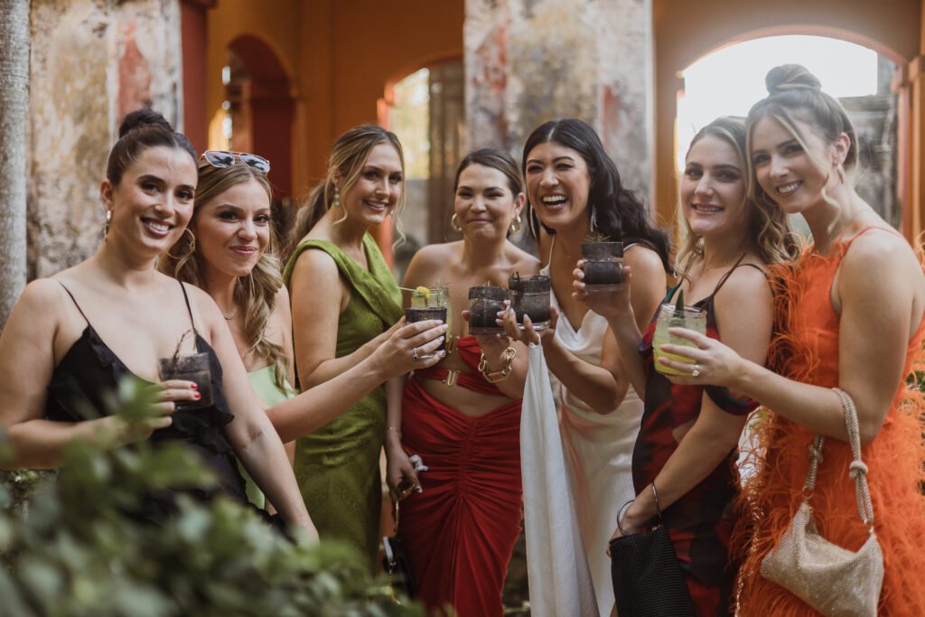Guests raising their glasses together during the cocktail hour