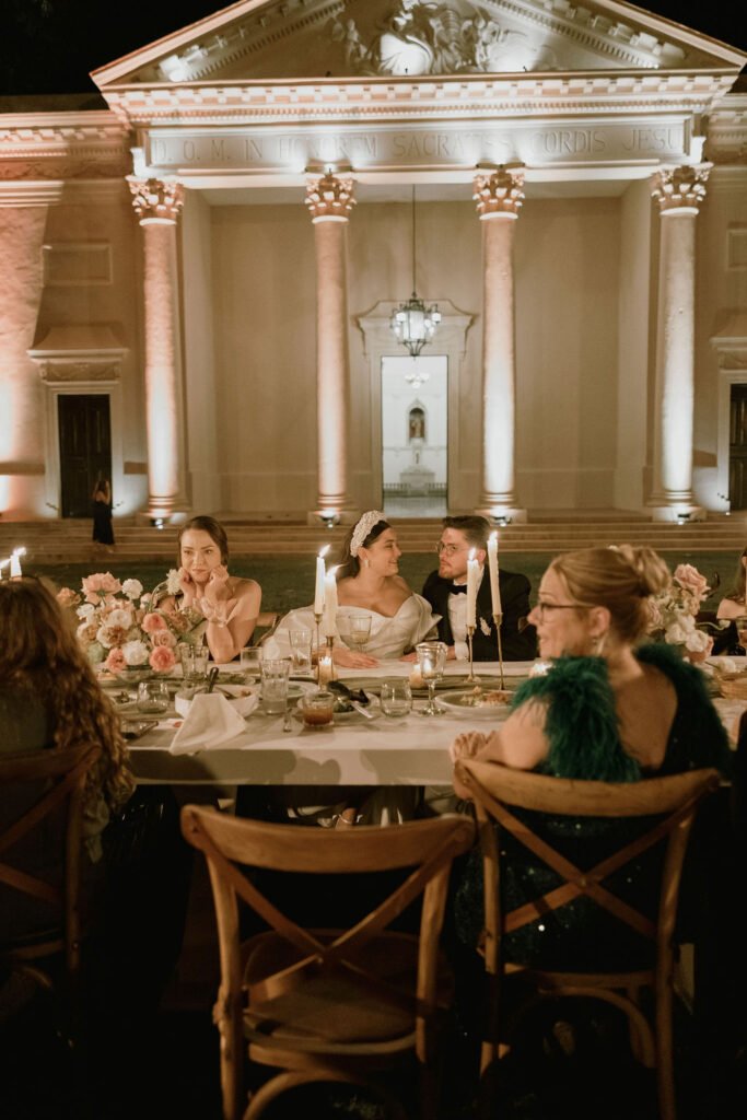 Dinner beneath the columns of the hacienda, lit by candles