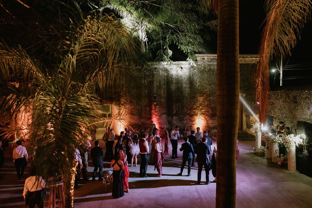 Dancing outdoors at night beneath the palms