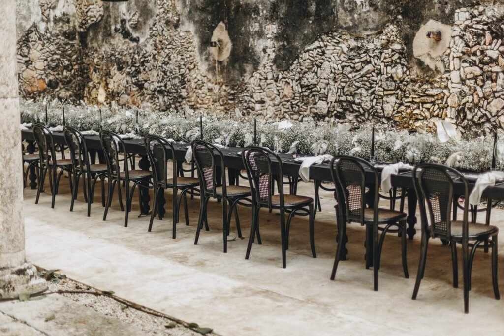 Chairs set out for the ceremony in the roofless hacienda hall