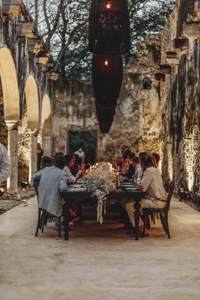 Dinner served under the arcade by lamplight