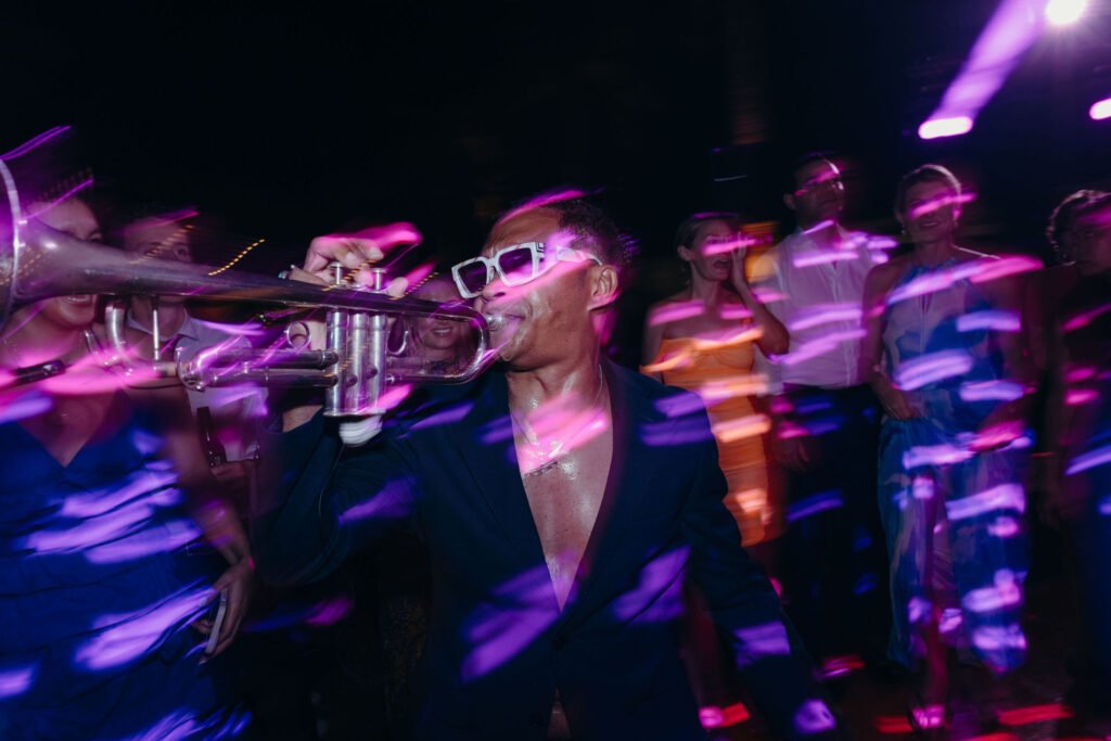 Dancing under coloured lights late in the evening