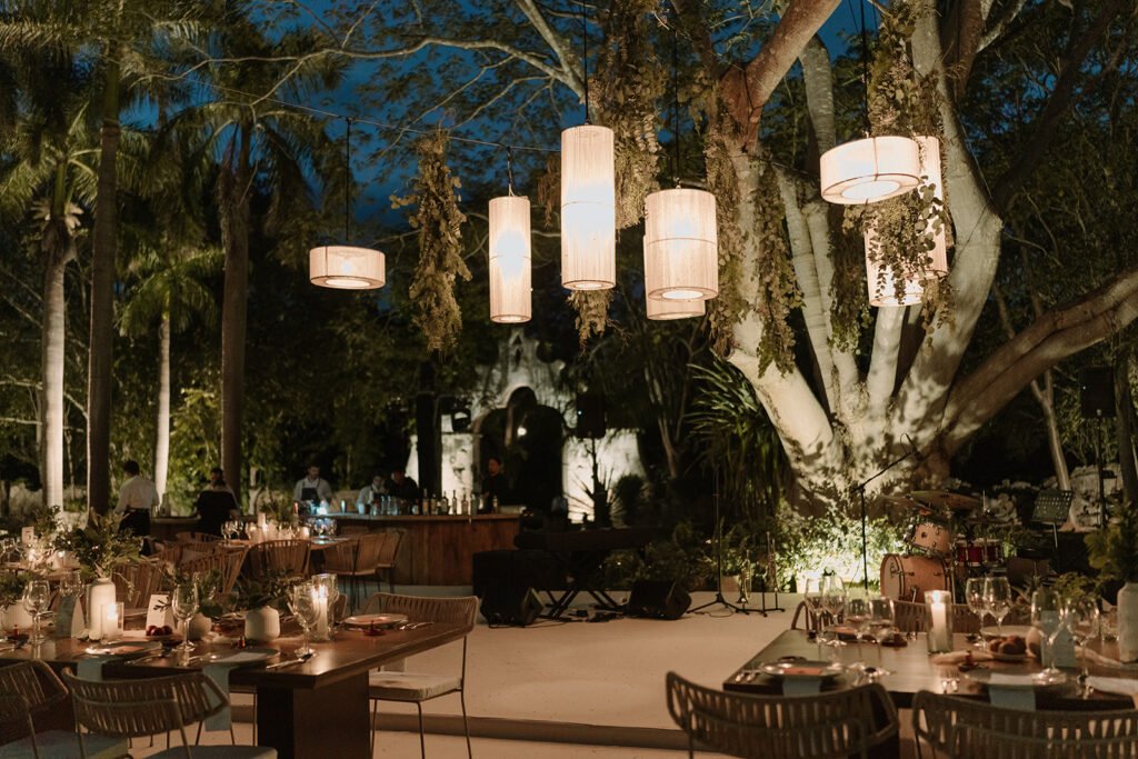 The reception at night under great trees strung with lanterns